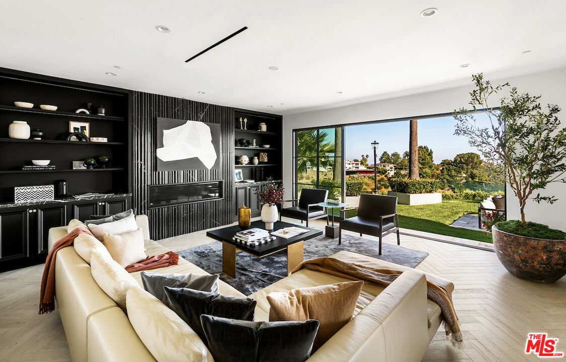 10932 Savona Road Los Angeles, CA 90077 - Photo 29 of 72 a living room with furniture and a large window