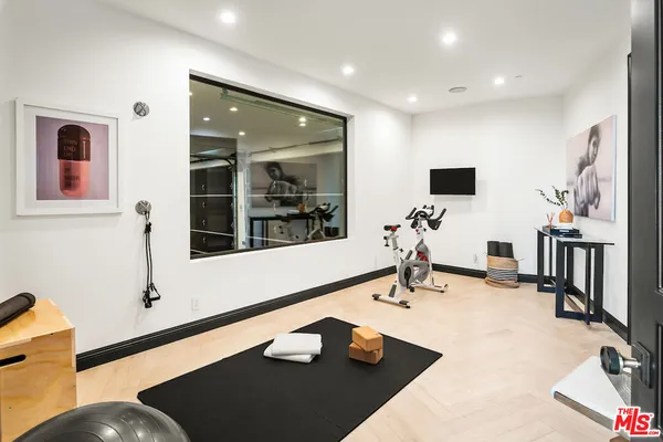 a bathroom with a shower and a sink