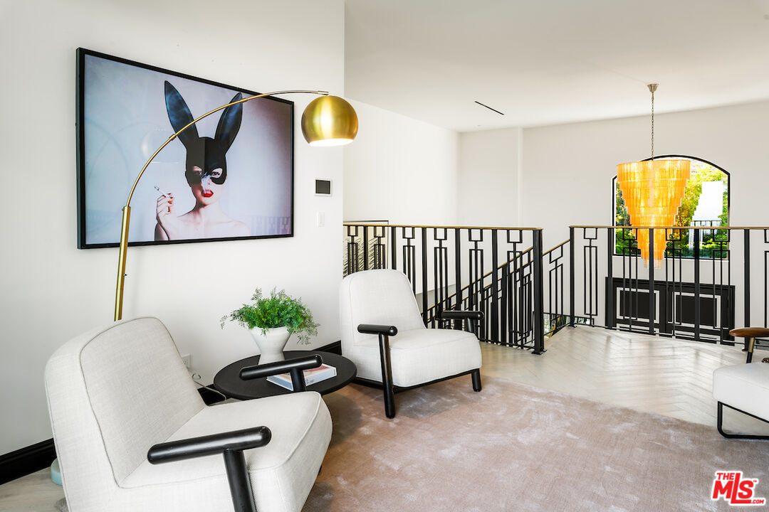 10932 Savona Road Los Angeles, CA 90077 - Photo 36 of 72 a living room with furniture and white walls
