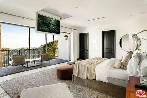 a bed room with a bed and a couch