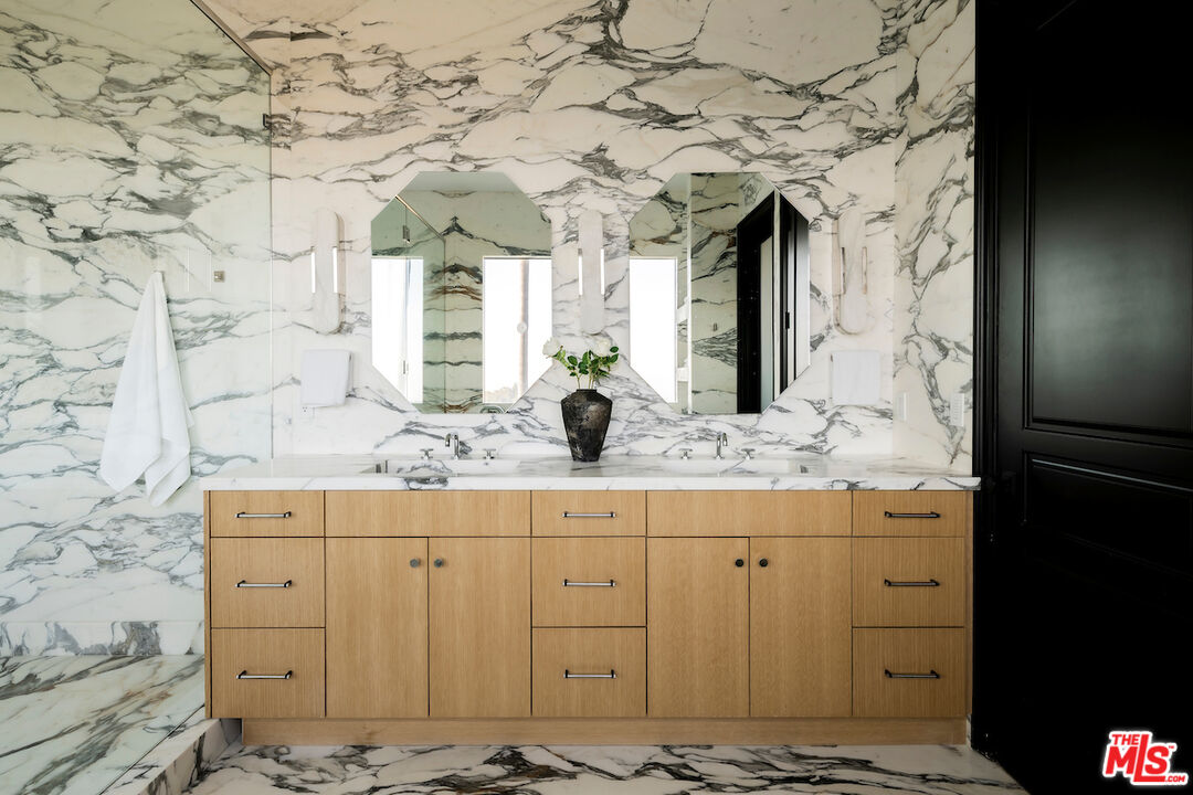 10932 Savona Road Los Angeles, CA 90077 - Photo 44 of 72 a bathroom with a sink and a mirror