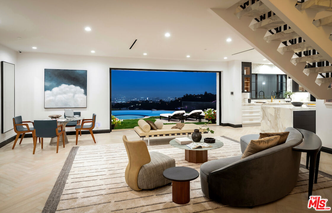 10932 Savona Road Los Angeles, CA 90077 - Photo 68 of 72 a living room with fireplace furniture and a flat screen tv