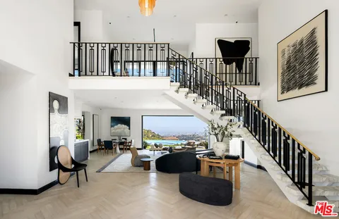 a living room with fireplace furniture and a flat screen tv