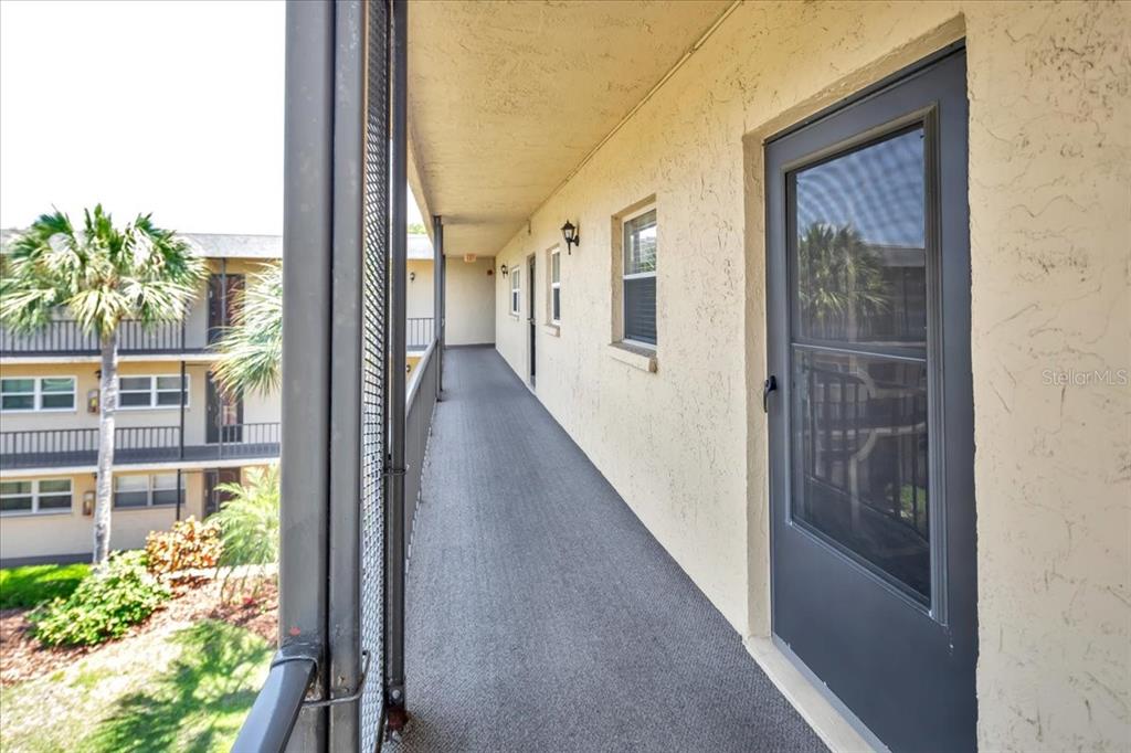 11485 Oakhurst Road, Unit 200321 Largo, FL 33774 - Photo 3 of 28 a view of hallway with windows