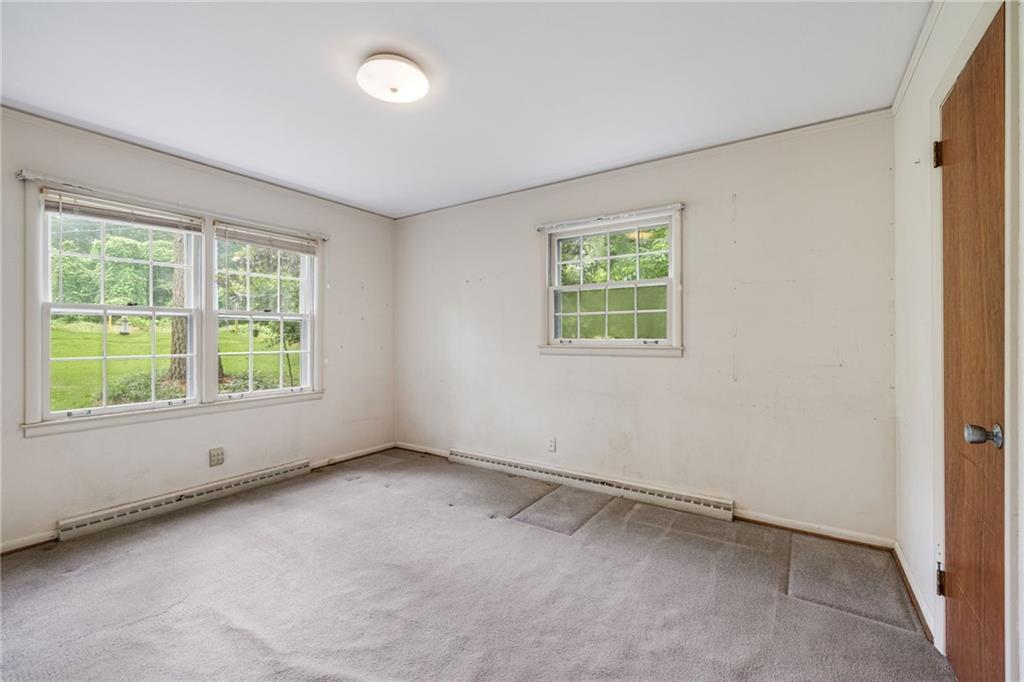 1911 Alderbrook Road Northeast Atlanta, GA 30345 - Photo 18 of 33 an empty room with a window