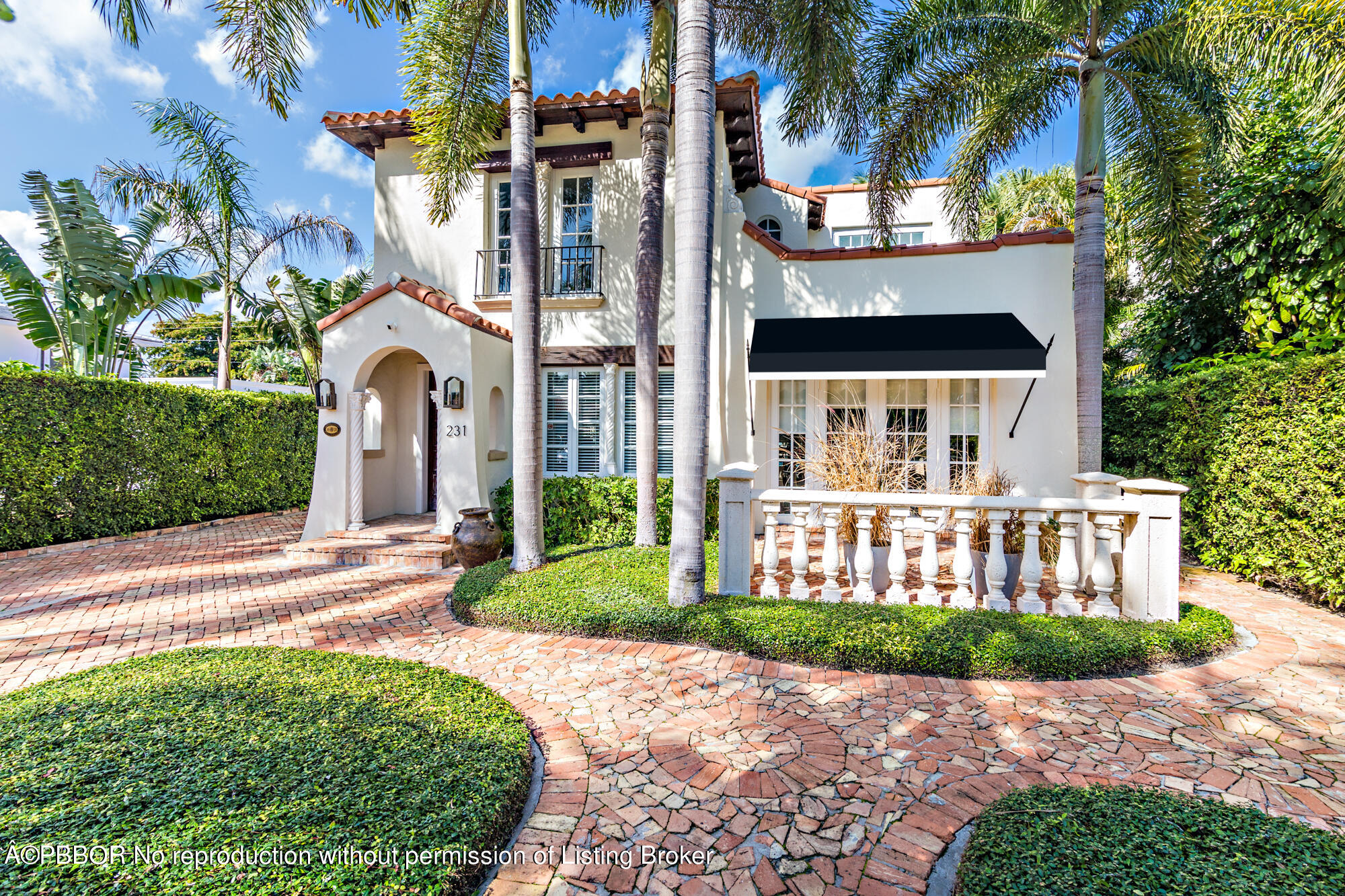 231 Sunset Road West Palm Beach, FL 33401 - Photo 2 of 22 front view of a house with a yard
