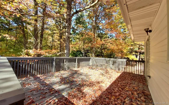 a view of balcony with wooden floor