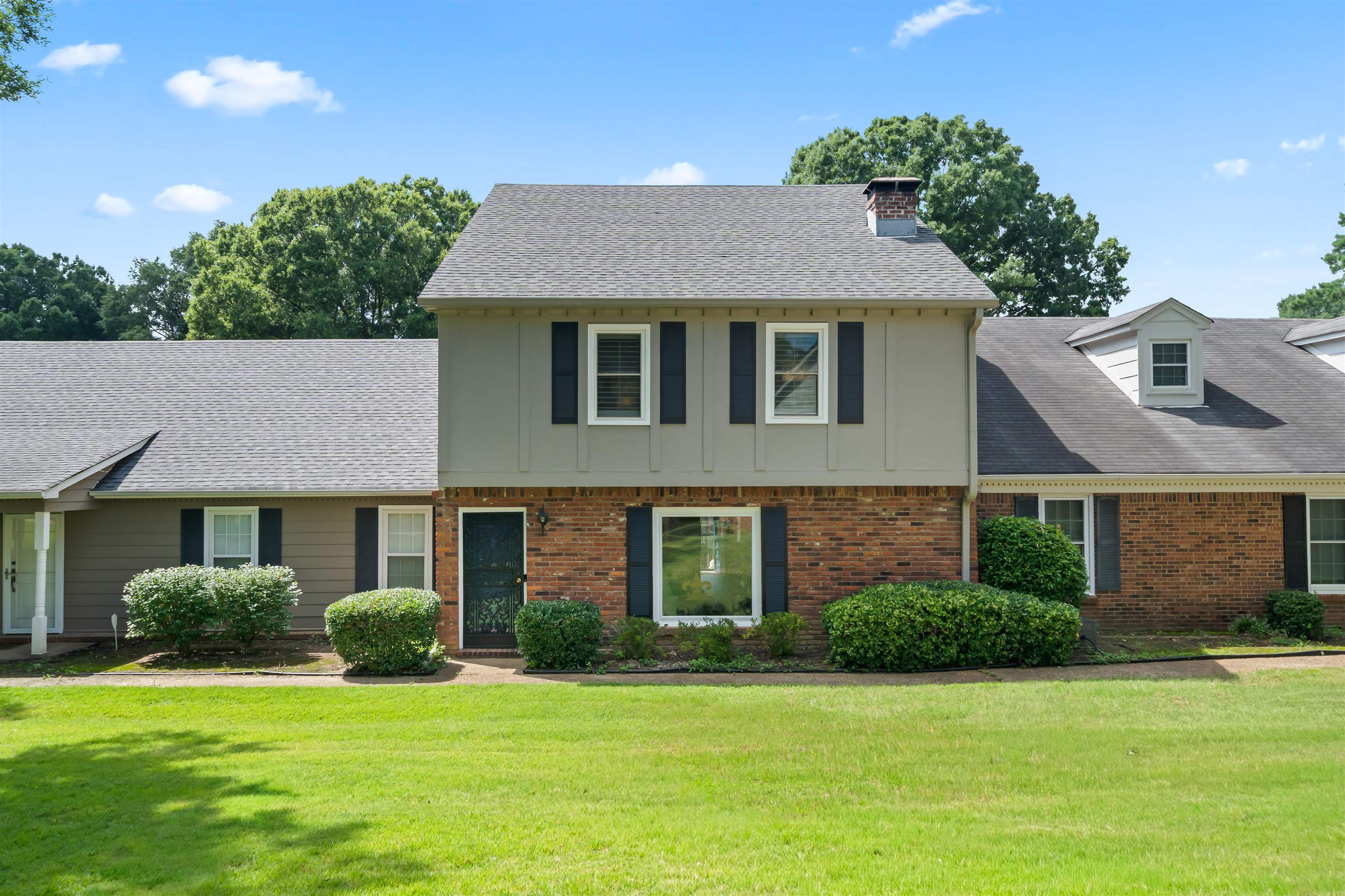 6943 Fords Station Road, Unit 64 Germantown, TN 38138 - Photo 1 of 30 Traditional brick and siding exterior with a multi-level roofline