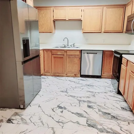a view of a kitchen with a sink