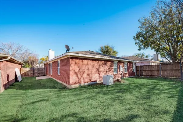 a view of a backyard with a small cabin