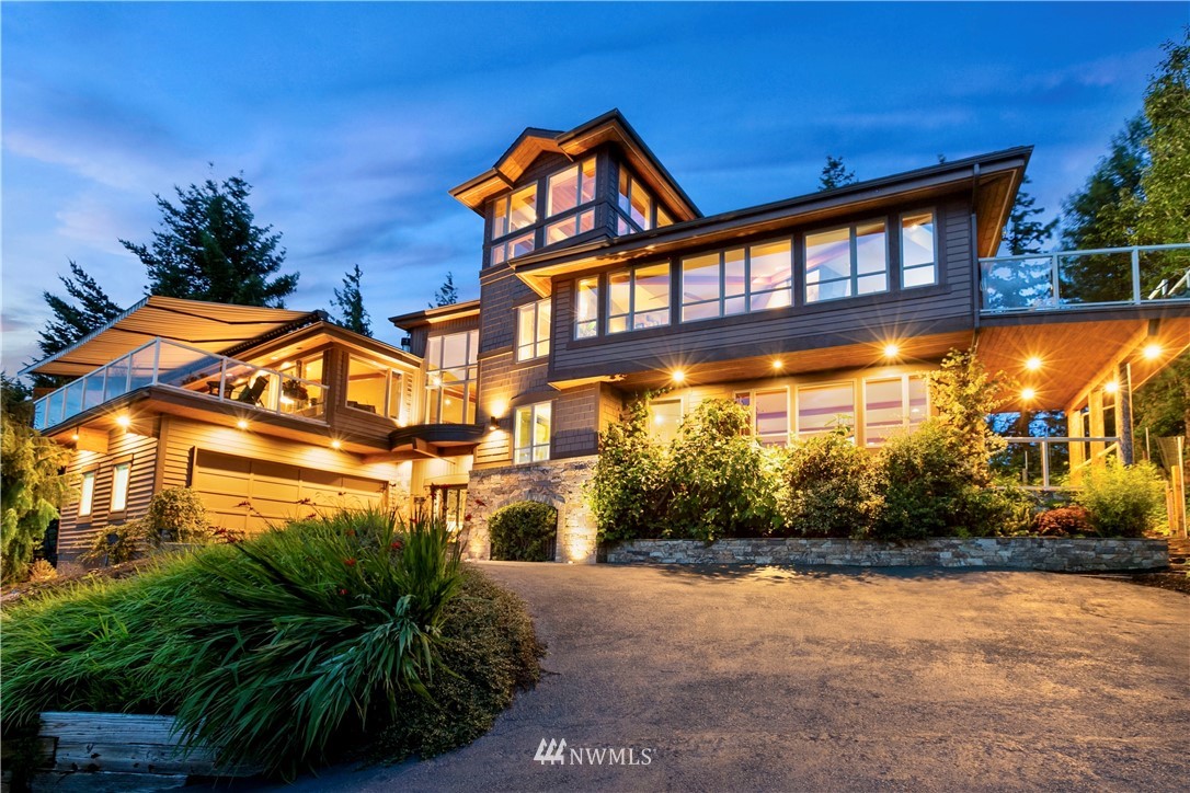 a view of a brick house with a yard