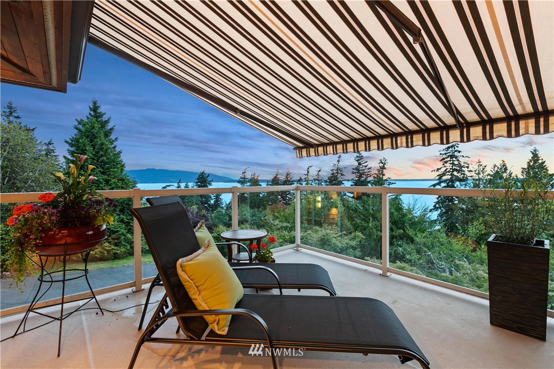 711 Briar Road Bellingham, WA 98225 - Photo 21 of 40 a view of a patio with table and chairs and potted plants