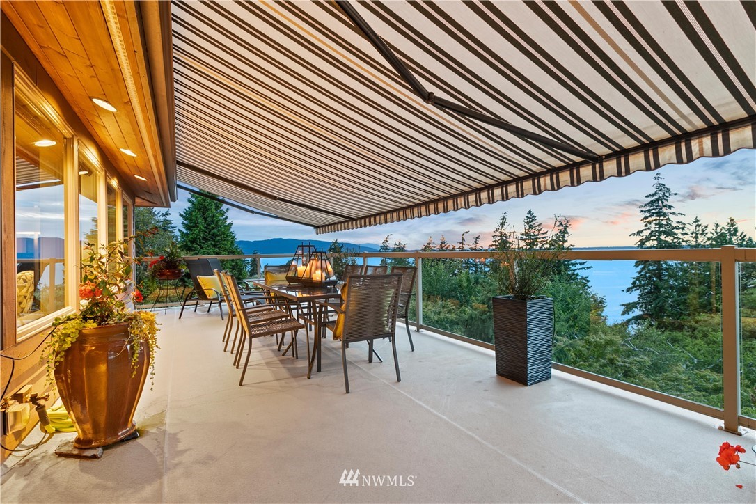 711 Briar Road Bellingham, WA 98225 - Photo 22 of 40 a patio with table and chairs and potted plants