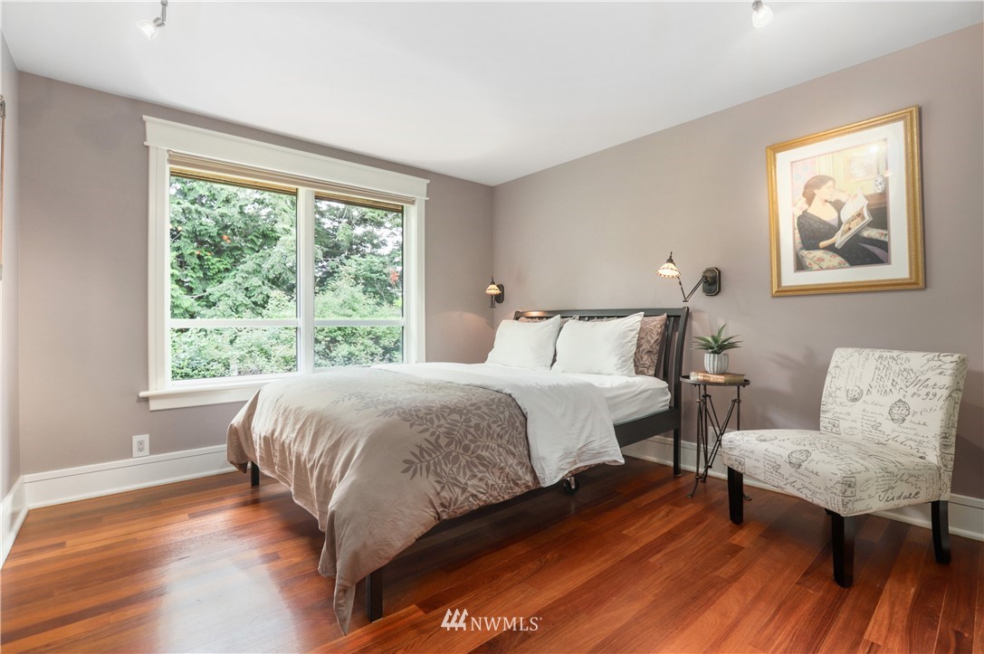 711 Briar Road Bellingham, WA 98225 - Photo 29 of 40 a bedroom with a bed and wooden floor