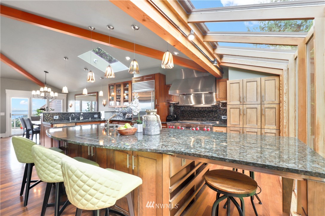 711 Briar Road Bellingham, WA 98225 - Photo 4 of 40 a view of a dining room with furniture a chandelier and wooden floor