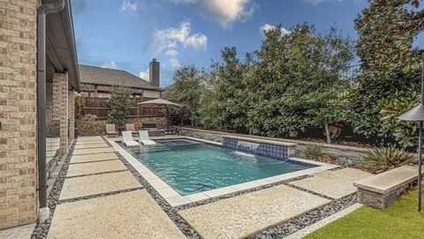swimming pool view with a outdoor seating space