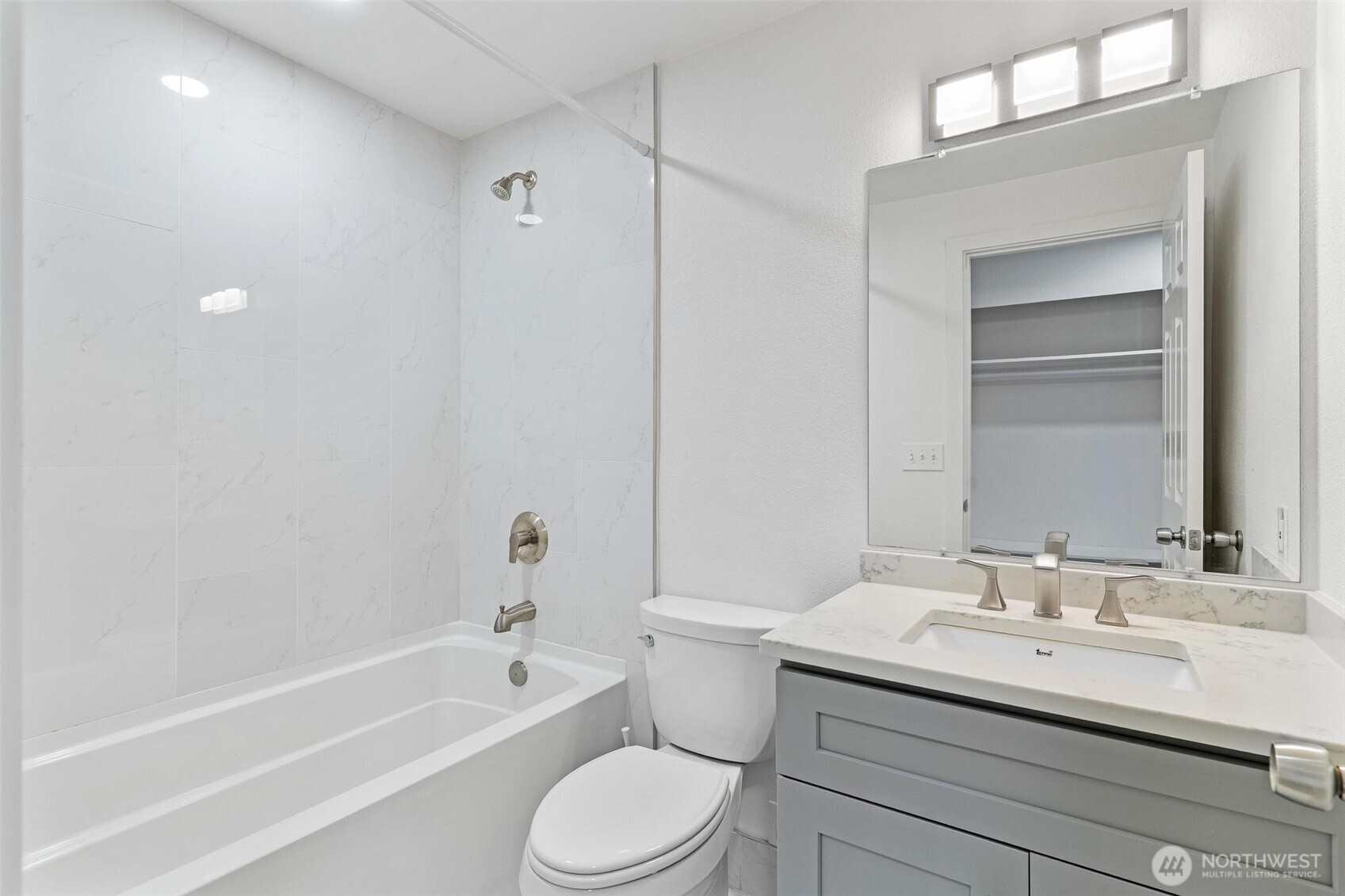 2020 Grant Avenue South, Unit B201 Renton, WA 98055 - Photo 11 of 20 a bathroom with a sink toilet a bathtub and a vanity