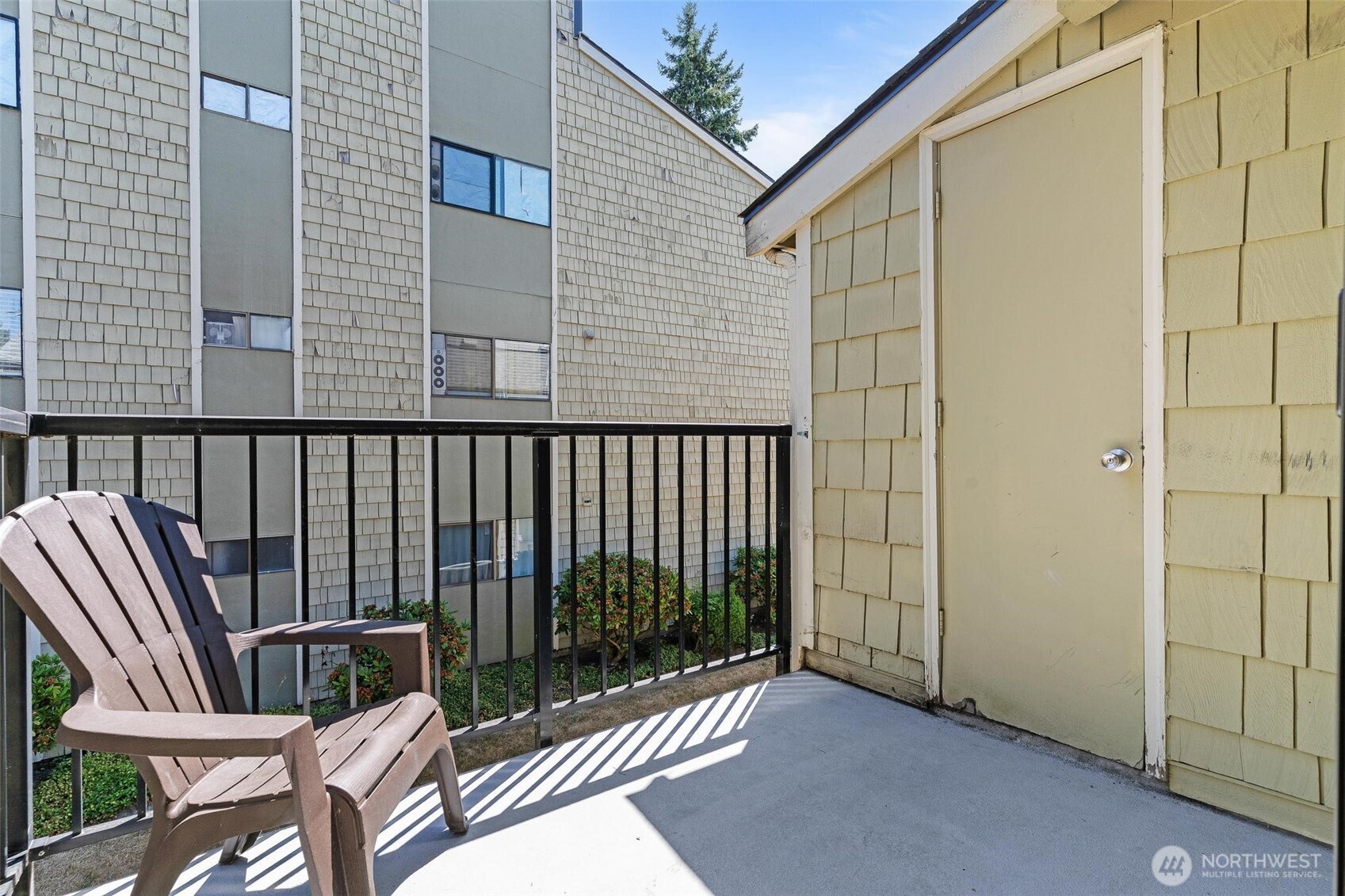 2020 Grant Avenue South, Unit B201 Renton, WA 98055 - Photo 13 of 20 a view of a balcony with furniture