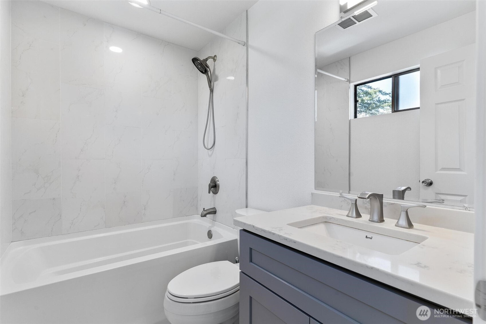 2020 Grant Avenue South, Unit B201 Renton, WA 98055 - Photo 9 of 20 a bathroom with a granite countertop sink a toilet and shower