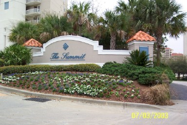 414 Summit Destin, Unit 414 Destin, FL 32550 - Photo 1 of 1 a front view of a house with a yard and fountain in middle