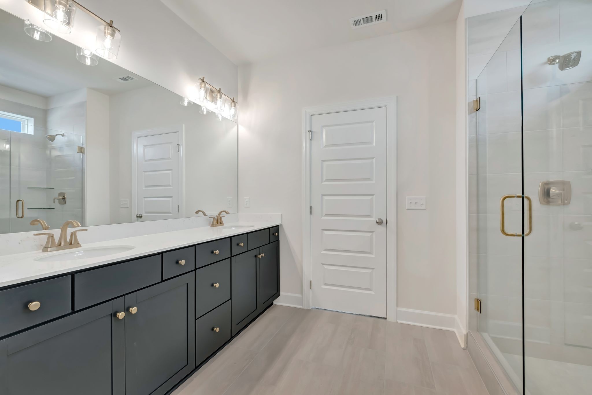 1109 Codah Drive Mount Juliet, TN 37122 - Photo 12 of 19 a spacious bathroom with a double vanity sink a large mirror and shower