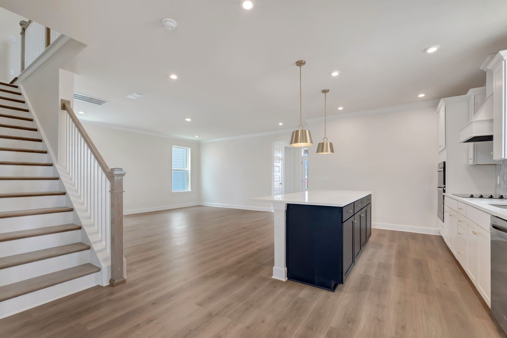 1109 Codah Drive Mount Juliet, TN 37122 - Photo 4 of 19 a kitchen with wooden floors and cabinets