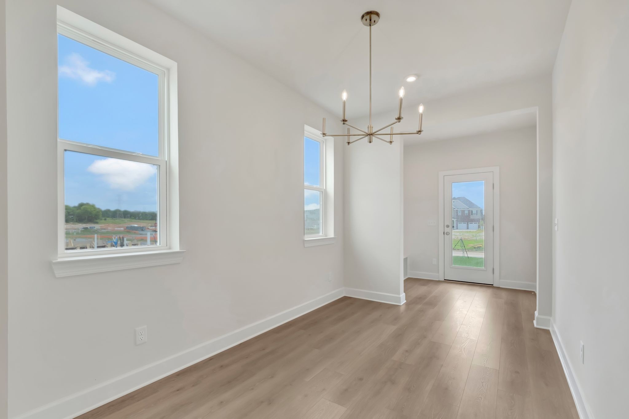 1109 Codah Drive Mount Juliet, TN 37122 - Photo 9 of 19 a view of an empty room with wooden floor and a window