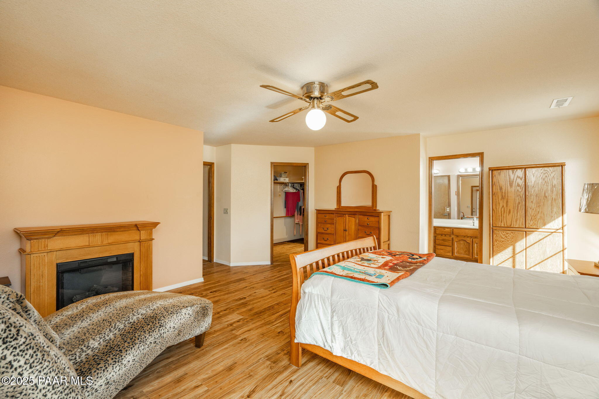 11992 Rawhide Ridge Dewey, AZ 86327 - Photo 14 of 46 a bedroom with a bed and a fireplace