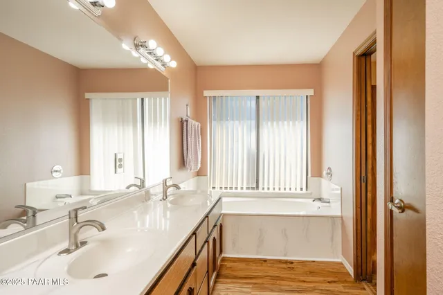 a bathroom with a toilet and a bath tub