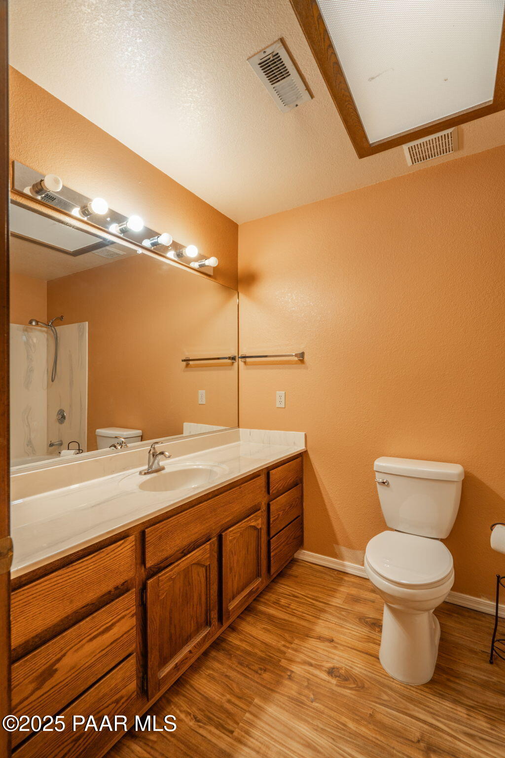 11992 Rawhide Ridge Dewey, AZ 86327 - Photo 21 of 46 a bathroom with a granite countertop sink toilet and a mirror