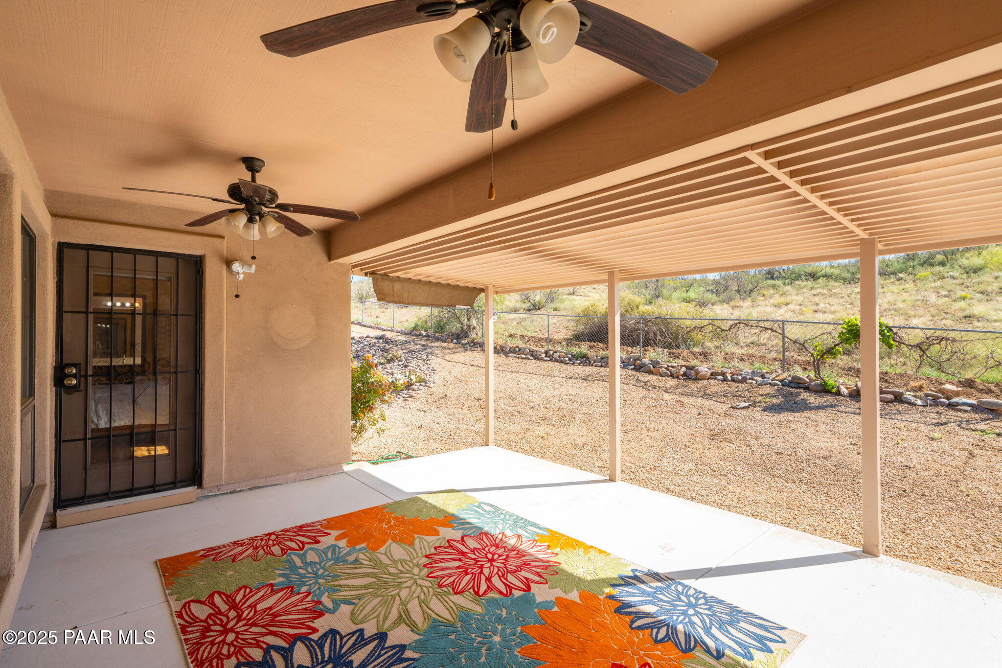 11992 Rawhide Ridge Dewey, AZ 86327 - Photo 24 of 46 a bedroom with a bed and a large window