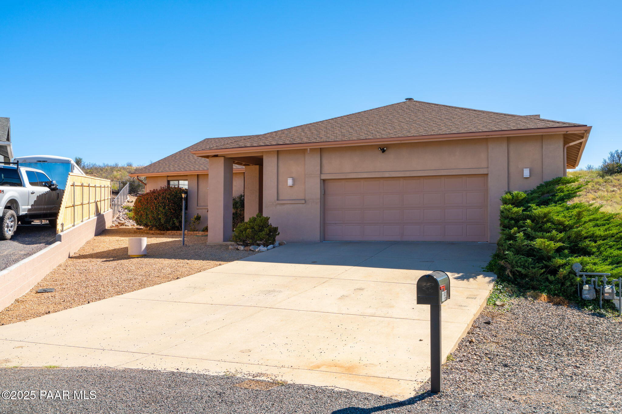 11992 Rawhide Ridge Dewey, AZ 86327 - Photo 31 of 46 a front view of a house with a yard