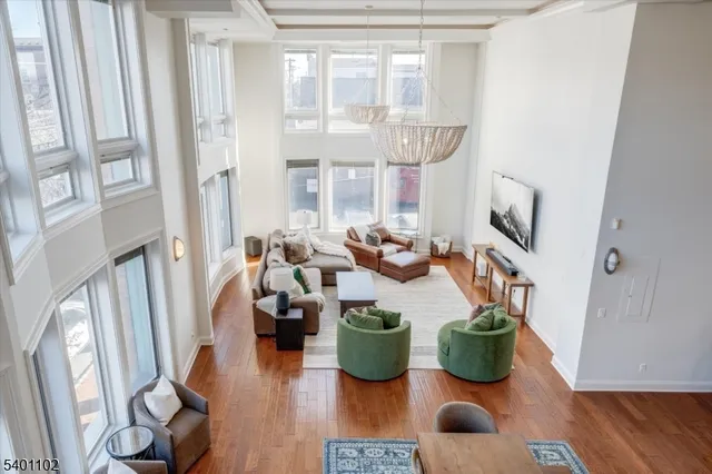 a room with lots of furniture and wooden floor