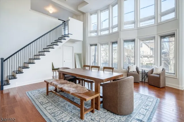 a living room with furniture rug and wooden floor