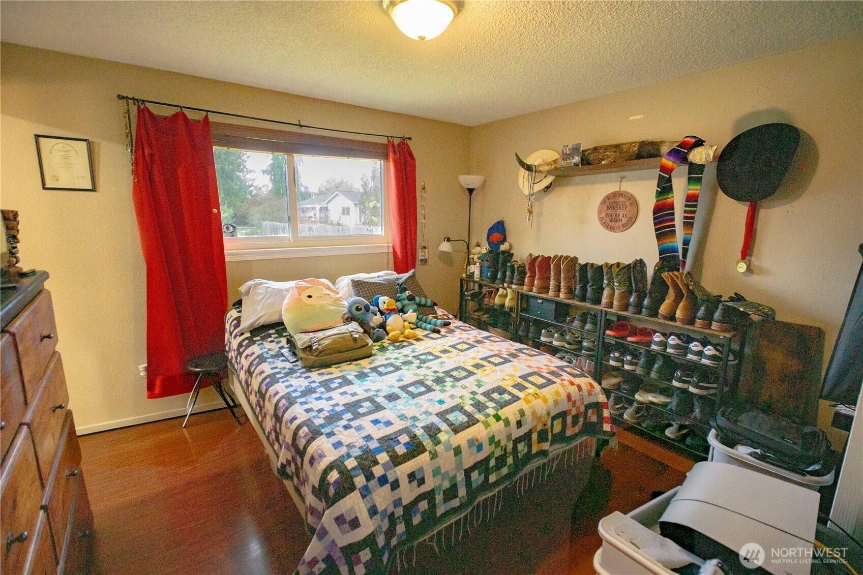 151 Valley View Drive Sequim, WA 98382 - Photo 26 of 40 a bedroom with a bed and a window