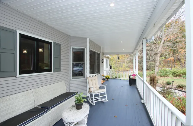 a lobby with furniture and large windows