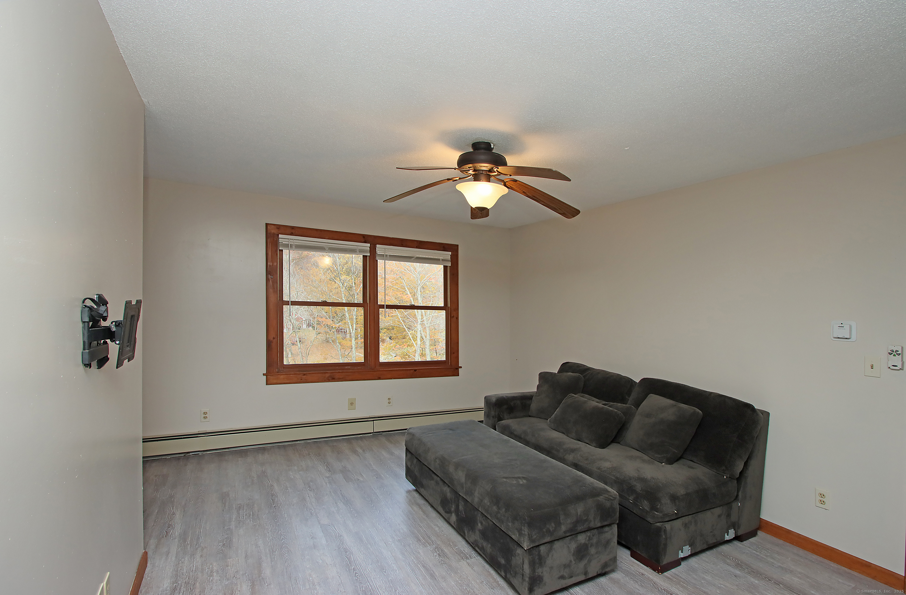 821 Essex Road Westbrook, CT 06498 - Photo 31 of 40 a living room with furniture and a window