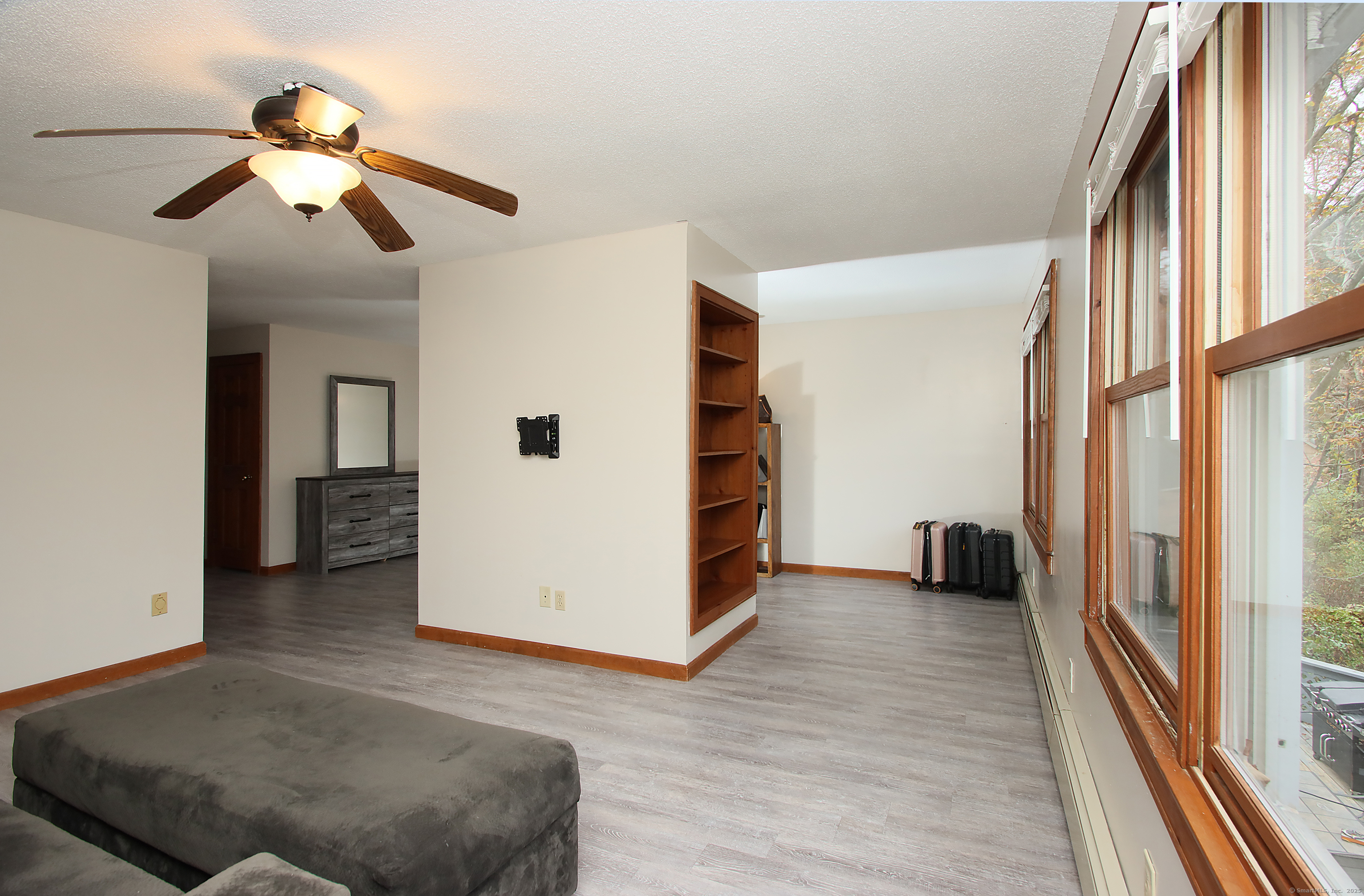 821 Essex Road Westbrook, CT 06498 - Photo 32 of 40 a view of a livingroom with furniture and staircase