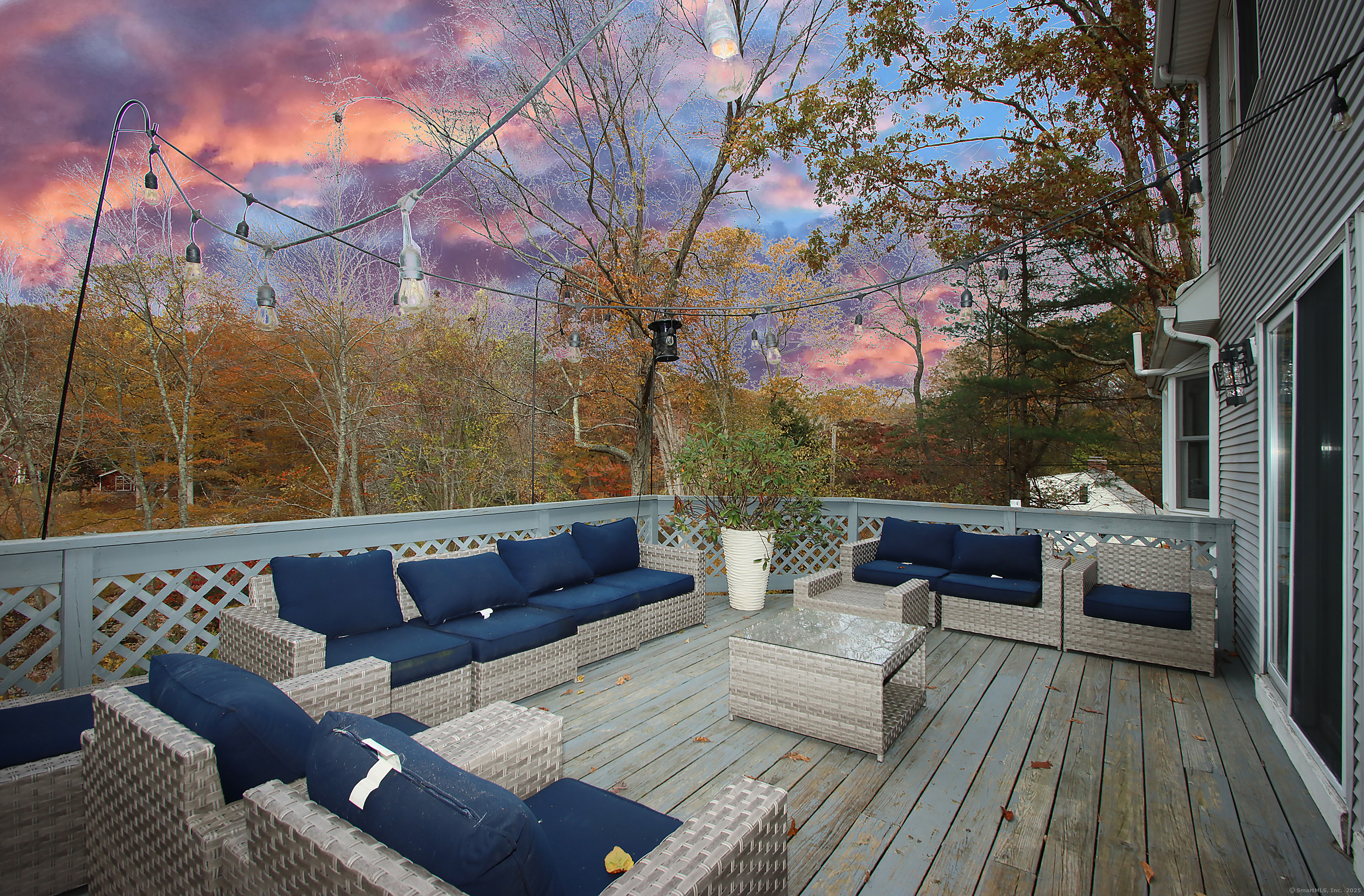 821 Essex Road Westbrook, CT 06498 - Photo 36 of 40 a roof deck with a couch and wooden floor