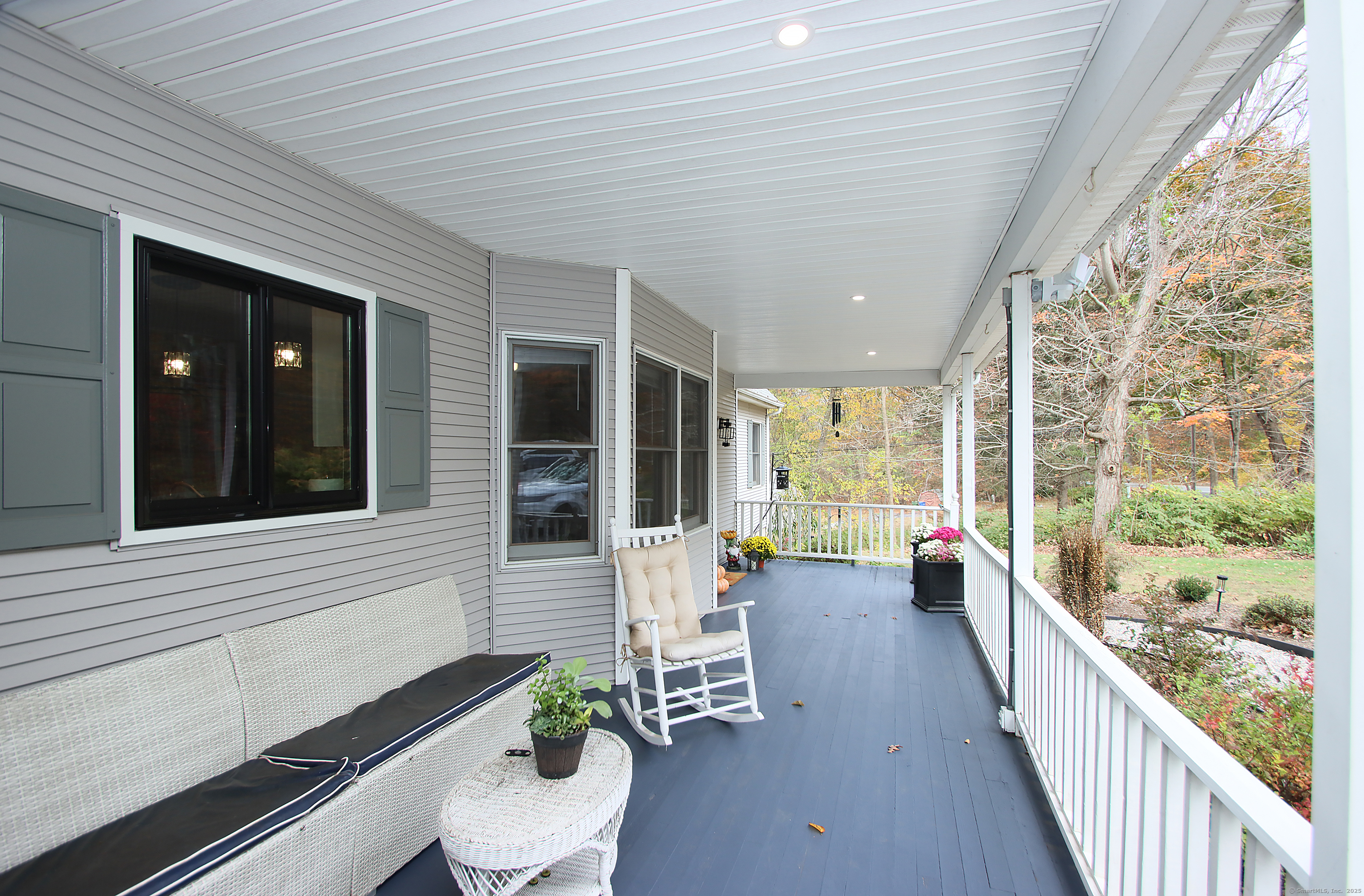 821 Essex Road Westbrook, CT 06498 - Photo 4 of 40 a lobby with furniture and large windows