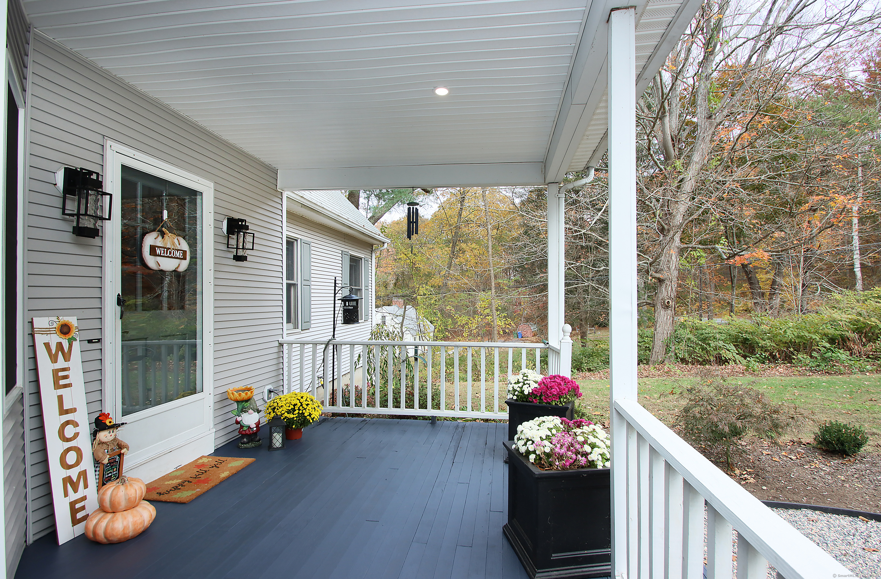 821 Essex Road Westbrook, CT 06498 - Photo 5 of 40 a bedroom with furniture and a large window