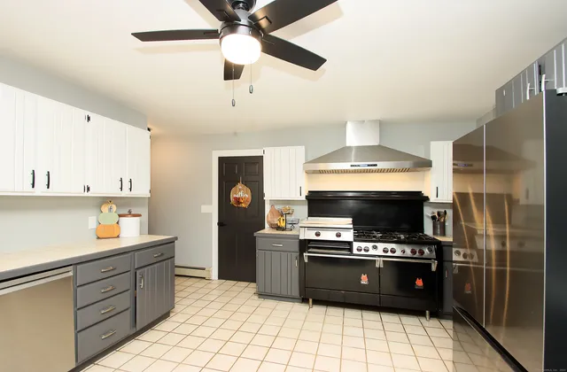 a kitchen with a stove a microwave and a refrigerator