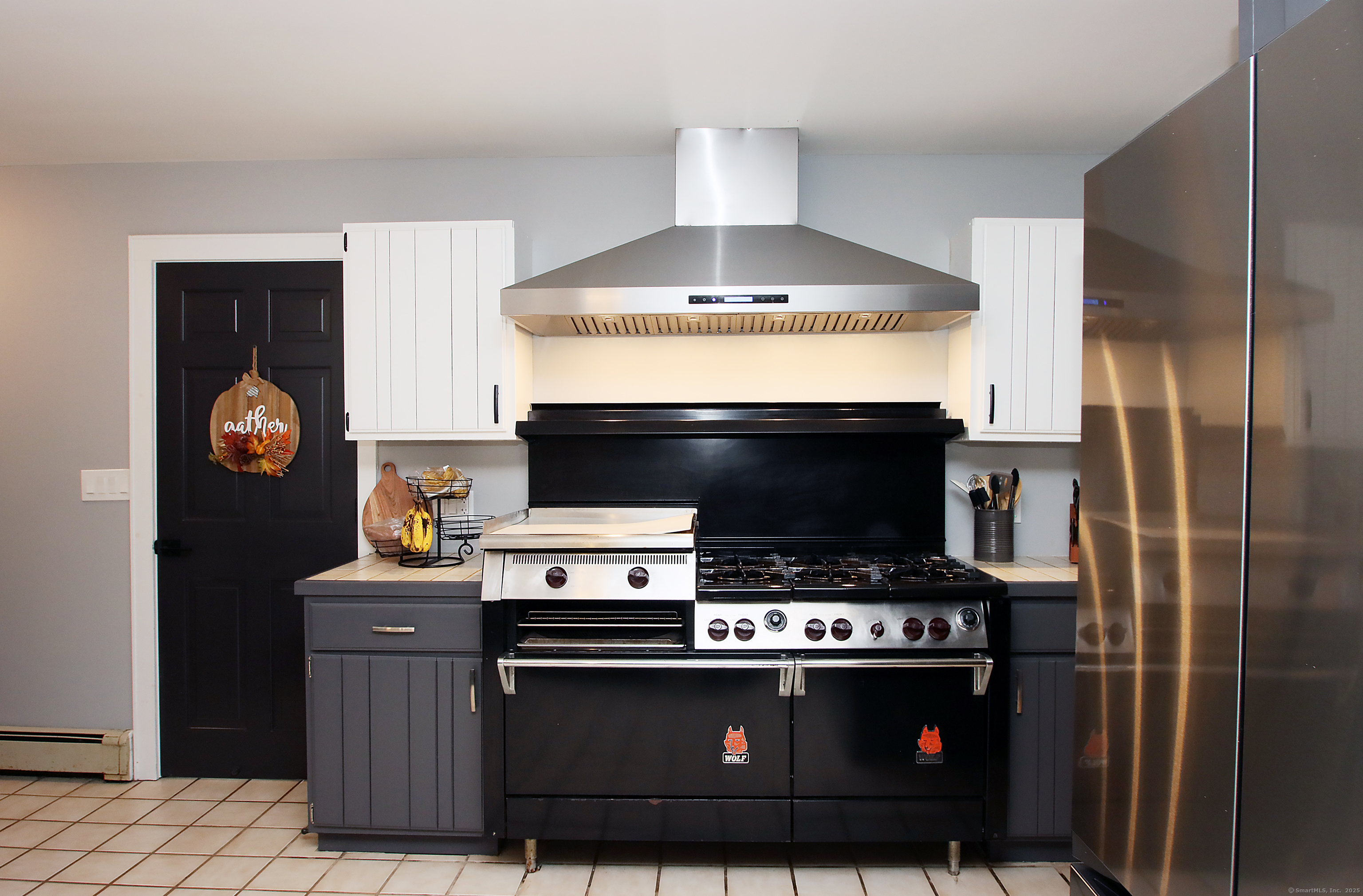 821 Essex Road Westbrook, CT 06498 - Photo 9 of 40 a stove top oven sitting inside of a kitchen