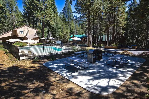 a view of a fire pit in a backyard of the house