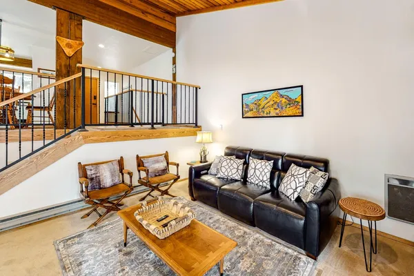 a living room with furniture and a rug