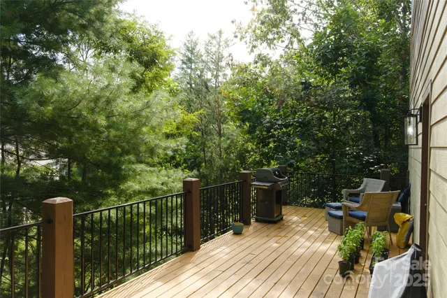 a view of balcony with deck and outdoor seating