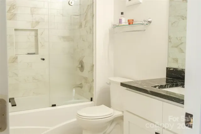 a kitchen with a stove and a refrigerator