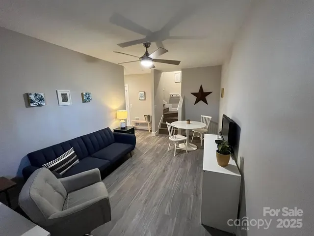 a workspace with furniture window and wooden floor