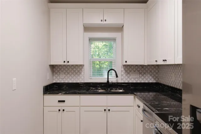 a kitchen with a stove and a microwave