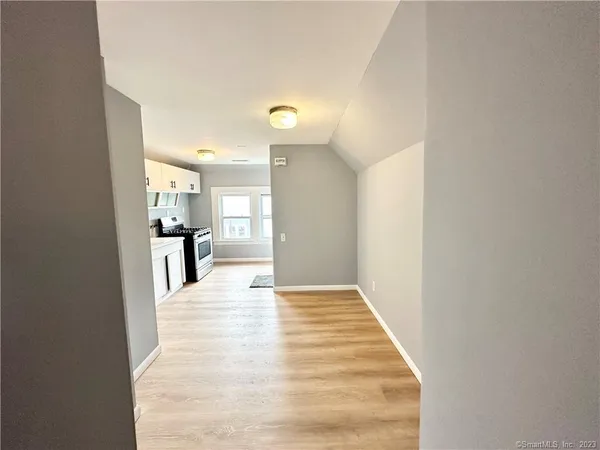 a view of kitchen with wooden floor
